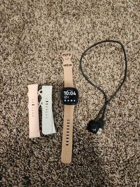 FitBit Versa 4 Watch with Rose Gold Leopard Band and Extra Straps